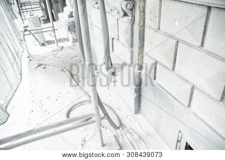 The Gun For Serving A High-pressure Sand Jet. Restoration Of Historical Buildind With Stone Carved D