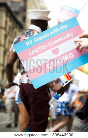 2018 JUNE 24 NEW YORK: Supporters of Democratic New York Governor Andrew Cuomo march along the 5th Ave parade route during the NYC Pride March.