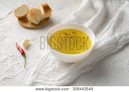 Home Cooked Boullion Or Clear Soup In A Ceramic Bowl At The Kitchen, Healthy Food And Diets