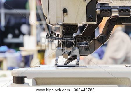 Sewing Mechanism Of Modern Industrial Overlock, Covered With Dust And Pile