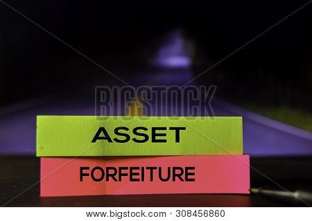 Asset Forfeiture On The Sticky Notes With Bokeh Background