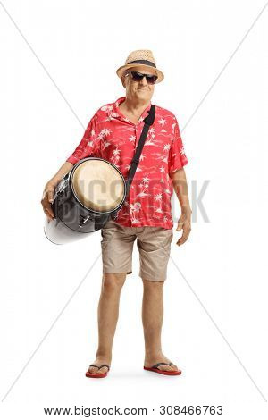 Full length portrait of an elderly male tourist with a conga drum isolated on white background