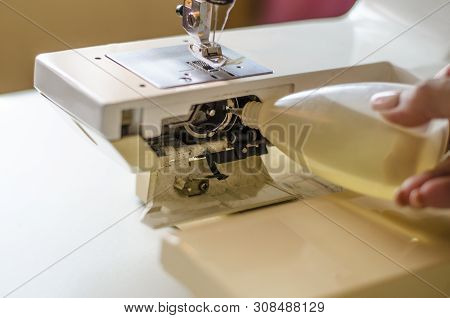 Sewing Machine. Work In The Light Built Into The Hardware Lamp. Steel Needle With Looper And Leg Clo