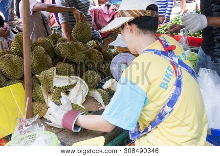 Bangkok, Thailand - 22nd April 2016: Woman Cutting Up Durian Fruit On Khong Toei Wet Market. This Is