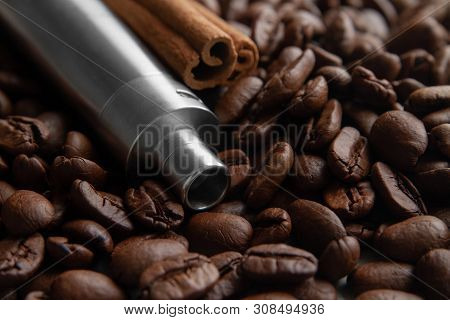 Coffee Beans, E-cigarette And Canella . Coffee And Cinnamon Flavored Vape Juice Concept