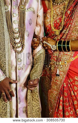 Bride And Groom In Indian Traditional Attire.