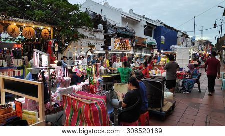 Melaka, Malaysia - 25 Jun, 2019: People Enjoy The Local Food At Night Market Located In Jonker Stree