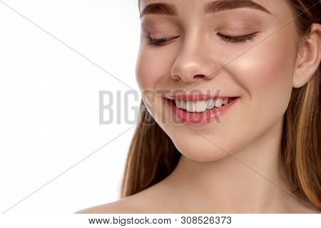 Pretty, Sexy, Attra Tive Girl With Perfect Skin, Pink Plump Lips, White Teeth And Long Hair Smiling 