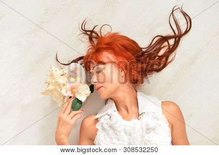 Portrait Of Beautiful Redhead Mature Woman Posing