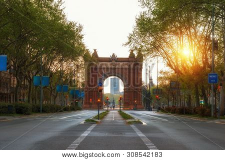 Bacelona Arc De Triomf During Sunrise In The City Of Barcelona In Catalonia, Spain. The Arch Is Buil