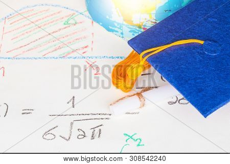 Graduation Cap On Paper Math Formula Equation Graph And Blur Of America Earth World Globe Model Map 