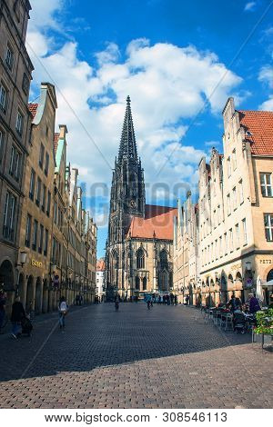 Munster, Germany - May 9: People On Street On May 9, 2013 In Munster, Germany. Largely Destroyed Dur
