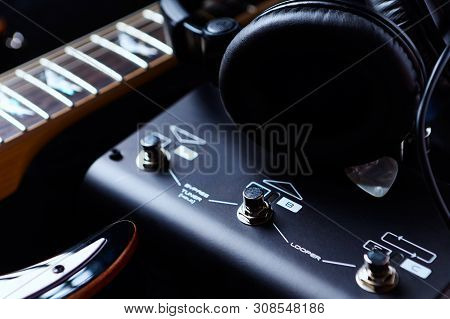 Multieffects Processor For Electric Guitar On Black Background.