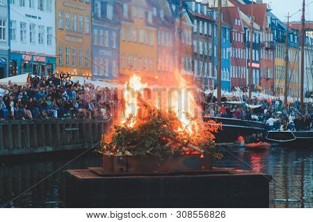 Copenhagen, Zealand Denmark - June 23 2019: Burning The Witch On Bonfire The Middle Of Nyhavn Canal 