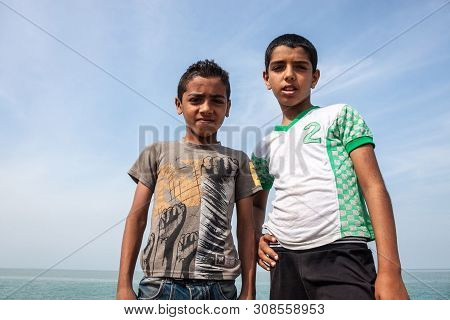 Hormoz, Iran - February 28: Small Boys Pose In Hormoz Village, Iran On February 28, 2013. Hormoz Is 