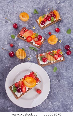 Crisp Bread With Creme Cheese, Fruit And Berries