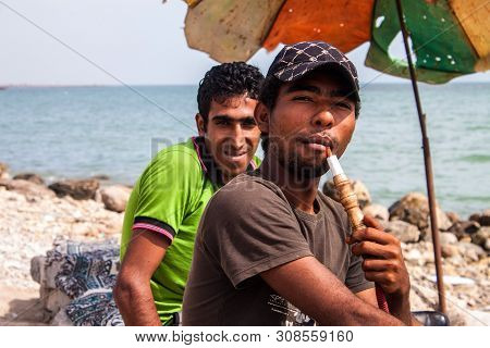 Bandar Abbas, Iran - February 28: Sea Coast With People Smoking Water Pipes In Bandar Abbas, Iran On