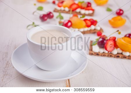 Cup Of Tea And Crisp Bread With Creme Cheese, Fruit And Berries