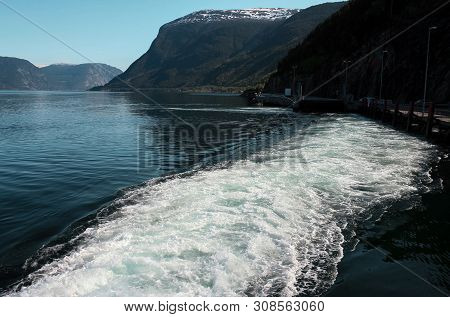 View On Fjords And A Backtrace Of A Boat From The Behind Desk And Mountains Behind, Norway