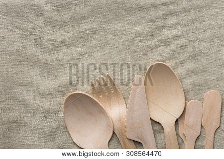 Wood Cutlery Spoons Fork Knife On Beige Linen Cloth. Zero Waste Plastic Free Reusable Biodegradable 