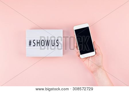 Creative Top View Flat Lay Of Lightbox With Hashtag Show Us Message And Mobile Phone In Hand Mockup 