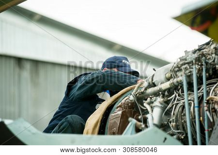 Tyumen, Russia - June 19, 2019: Aircraft Repair Helicopter Utair Engineering Plant. Male Mechanic In