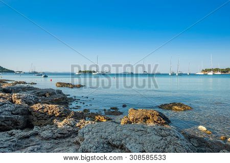 Yachting Paradise, Anchored Sailing Boats And Yachts In The Morning In Blue Bay On Croatian Adriatic