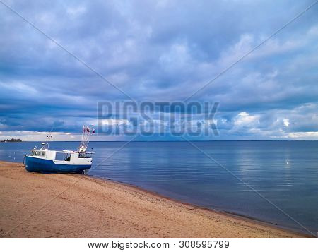 Fishing Boat On Baltic Sea Coast. Stormy Weather. Mechelinki, Poland, Pucka Bay.