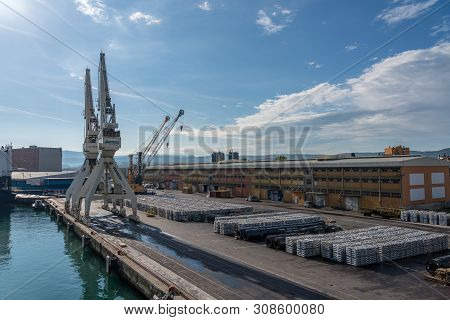 Koper, Slovenia - 24 May 2019: Cranes Line The Quayside In The Port Of Koper In Slovenia