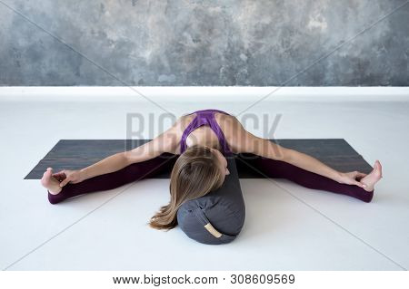 Caucasian Woman Doing Youga Splits Upavistha Konasana On Fitness Mat