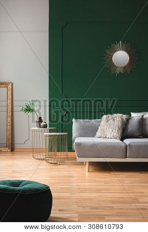 Emerald Green Living Room Interior With Grey And Golden Accents