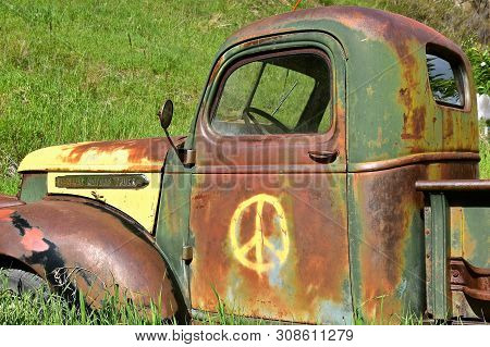 Rochford, Spouth Dakota, June 24, 2019:  The Old Rusty Truck With A Peace Sign Is A Gmc, General Mot