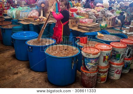 Pakse, Laos - Sep 13: Preparation Of A Fish Sauce On A Market In Pakse, Laos On Sep 13, 2013. Pakse 