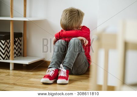 Kid With Depression Sits In The Corner Of The Room, And Lose Interest In Activities And Schoolwork