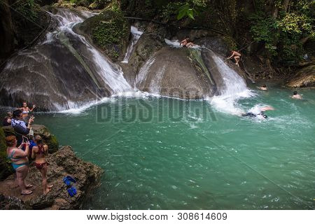 Erawan, Thailand - Aug 25: People Bath In Erawan Waterfall, Thailand On Aug 25, 2013.waterfall Is Na