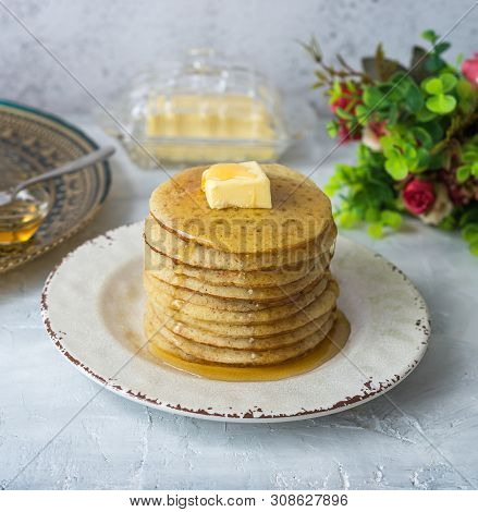 Moroccan Pancakes Baghrir Or Beghrir Or Crapes With 1000 Holes Served With Honey And Butter On Grey 