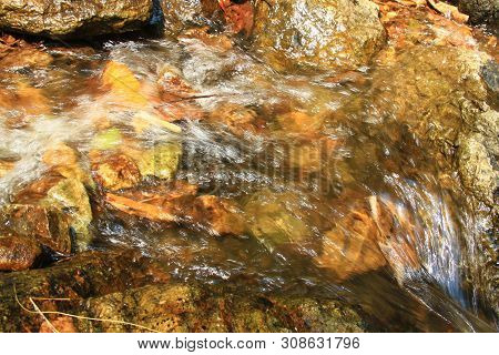 The Clear Water Flows Through The Gravel Are Smooth And Very Cool. Originated From Natural Waterfall