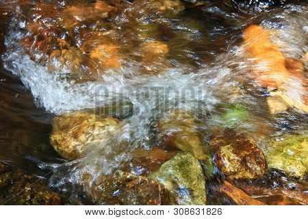 The Clear Water Flows Through The Gravel Are Smooth And Very Cool. Originated From Natural Waterfall