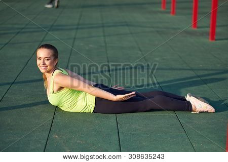 Stretching Fit Or Dancer Woman Doing Exercise In Workout Sports Ground