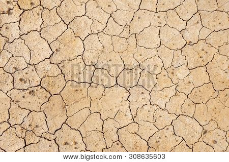 Brown Dry Soil Or Cracked Ground Texture Background.