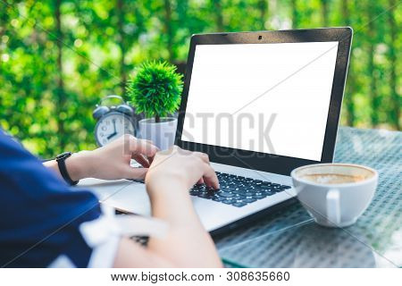 Close-up Of Business Female Working With Laptop, Coffee, Clock, Smart Phone, And Notebook On Office 