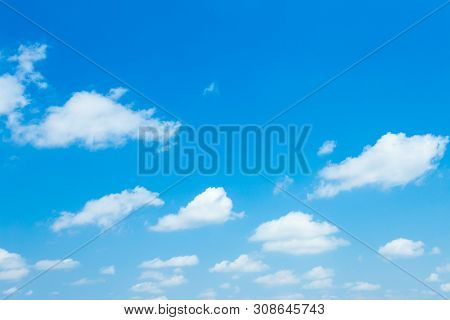 Blue Sky Background Texture With White Clouds.