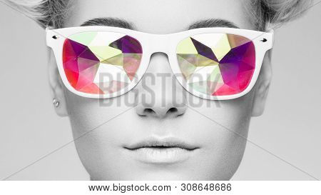 Portrait Of Beautiful Young Woman With Colored Glasses. Beauty Fashion. Perfect Make-up. Colorful De