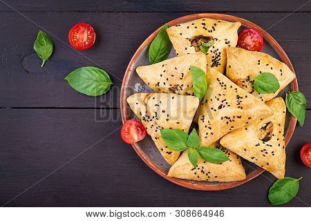 Asian Food. Samsa (samosa) With Chicken Fillet And Green Herbs On Wooden Background. Top View