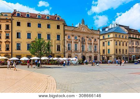 Krakow, Poland - June 18, 2019: Panorama Of Main Market Square Rynek Glowny With Houses And House Ca