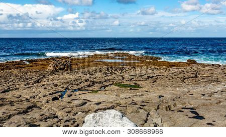 Bare Limestone Landscape And Ocean In Doolin Bay, Next To The Pier, Wild Atlantic Way, Beautiful Sun
