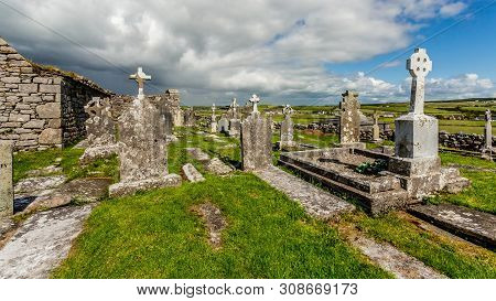 View Of The Ruins Of The Medieval Church Of Killilagh And The Graveyard In The Village Of Doolin, Be