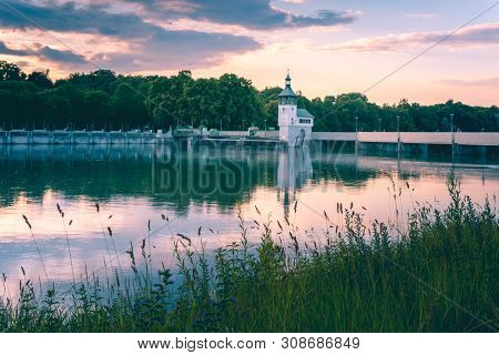 Image Of Reservoir Lake With Water Reflections During Sunset