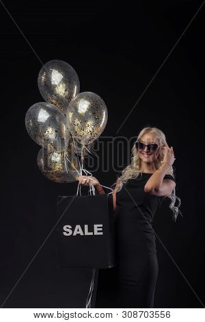 Sale Concept. Brightfull Expressions Of Happy Emotions Of Amazing Girl Celebrating Party On Black Ba