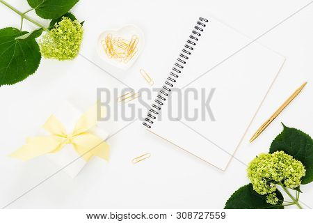 Flat Lay Fashion Office Desk. Female Workspace With Blank Paper Notepad, Golden Stationery, Green Fl